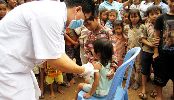 girl getting vaccined